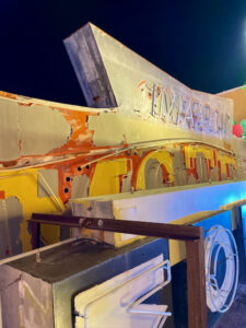 Photo of a stack of unlit vintage neon signs